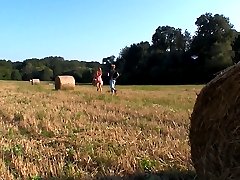 This hay bale is their bed today. Underneath the warm sun feels so natural for these horny teen lovers. They may love right out in the open, with no cares in the world.