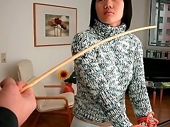 Pretty asian babe tied to the bed and caned hard on bare ass