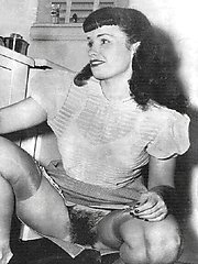 Ladies try stockings on and play with each other