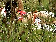 Topless sunbathing brunette filmed on voyeur cam