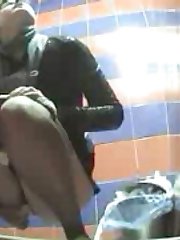 Pissing girls get busted and filmed in public loo