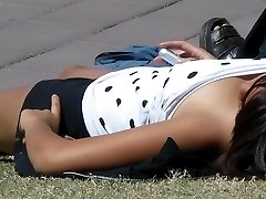 Sexy upskirt. Young prettie voyeured in a park.
