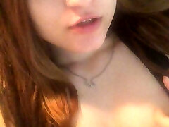 Redhead Asian drains her cunt with fingers and cums