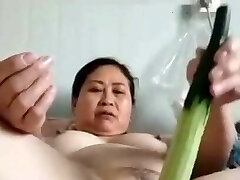 mature obese Chinese woman with veggie