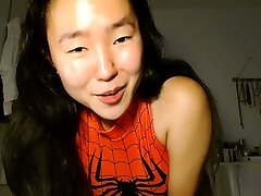 Shaved Asian milf squirting while jack on webcam