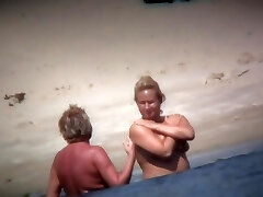 Mature woman displaying her saggy tits and ass on beach Mature woman displaying her saggy tits and ass on beach