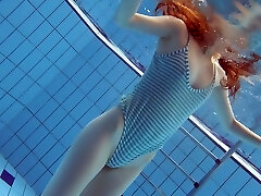 Slim hottie Libuse swimming nude in a pool in arousing sex video