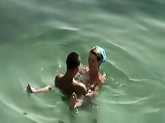 Small tits and puffy nipples naturist fucking in water