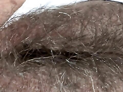 While I rest at the hotel on the beach, my chief films my humungous hairy pussy