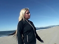 Playing with massive melons at the beach and fucking her hole at home