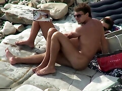 Breasty mega-bitch sucking cock on a beach