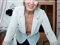 Lukerya tries on a jacket to a microskirt, shows naked boobs