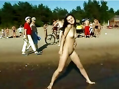 Slim nubile with perky boobs naked at a nudist beach Slim nubile with perky boobs naked at a nudist beach