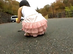 Japanese teen bends over and shows insatiable upskirt in the street