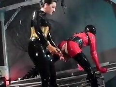 Woman fucks a dude in latex