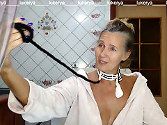 Torrid hostess Lukerya in the kitchen in a dressing gown.