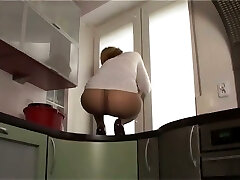 This slut luvs to show off her nylon covered butt on top of the kitchen counter