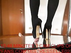 Domme Elle in high heels thigh boots tear up her slaves cock