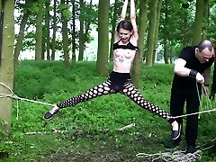 Submissive teen bound up in the woods