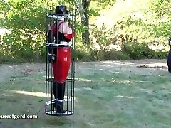spandex restrain bondage doll jewell caged and stored in silo