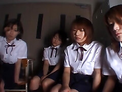 Four Japanese school ladies spitting on teacher