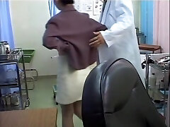 Nasty doc dildo penetrates Asian in the medical office
