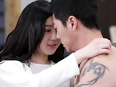 Japanese couple having intercourse on a couch