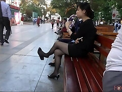 Chinese Office Lady having a break and dangling her heels