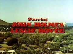 Classic porn with John Holmes getting his hefty fuck-stick sucked
