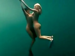 Busty naked swimmers make glamour underwater art