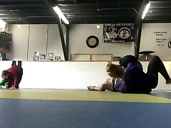 a highly skilled and flexible dancer is punching boys ass in wrestling compl