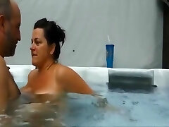 Mature couple having an impressive sex experience in their pool