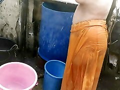 Anita yadav bathing outside with scorching