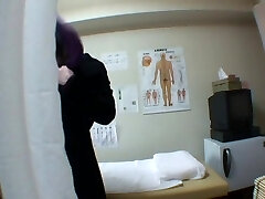 Hidden spy cam massage turns into fingering a lady's pussy