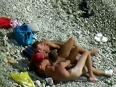 Fantastic chick and 2 horny dudes enjoy foreplay on the beach when I spy them