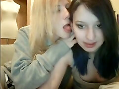 Two amateur brunette and towheaded lesbos flashed tits while kissing on webcam