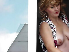 MILF in bathrobe without panties and bra washes window of apartment. Nude in public. Naked in public. Big natural tits Cougar MILF in bathrobe without panties and bra washes window of apartment. Nude in public. Naked in public. Big natural tits Cougar