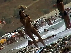 Voyeur video of naked girls having fun on a naturist beach