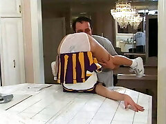 Marvelous young cheerleader fucks in the kitchen and gets a mouthful of spunk