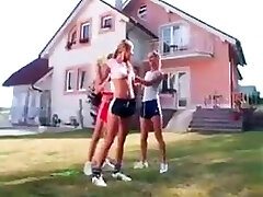 Girls in Adidas shine shorts and sports shoes