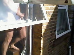 Window wank in the sunshine