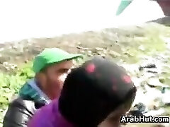 Arab In A Three-way Outdoors At A Farm