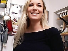 Extraordinaire German MILF with huge boobs dildoing her bald muff in the kitchen