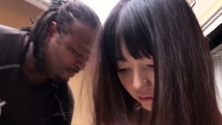 Tiny Japanese damsel gags on big ebony cock outdoors