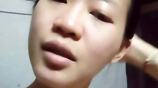 Asian woman is bored at home alone
