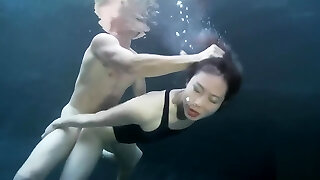 swimsuit girl hookup with a guy underwater