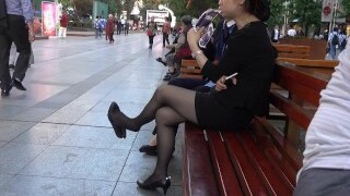Chinese Office Lady having a break and stringing up her heels