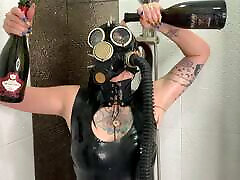 Dominatrix Nika in a gas mask pours wine over her owoll men body. mom brzer fetish