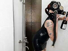 Backstage from the Halloween shoot. Mistress in a gas japanese housrwife and latex is doused with wine