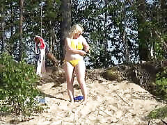 White-yellow-red and blue bikini in beach